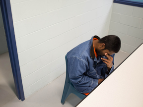 A Tamil asylum seeker in a visitor’s room at Krome Detention Center in Miami. After their capture by FBI authorities in 2010, five Sri Lankans identified Canadian citizen Srikajamukan Chelliah as their smuggler.