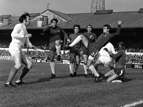 In this Oct. 18, 1969 file photo, West Bromwich Albion striker Jeff Astle (far left) stands near the opposing goal in a match against Chelsea. Astle's death at age 59 in 2002 was attributed to repeatedly heading heavy, leather soccer balls.