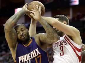 Then-Phoenix Suns power forward P.J. Tucker (left) battles for a rebound against the Houston Rockets on Feb. 11. The Toronto Raptors traded for Tucker on Feb. 23.