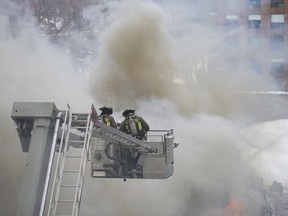 Firefighters battle a six-alarm fire at a racquet club at the intersection of Yonge St. and St.Clair Ave. West, in Toronto on Feb. 14.