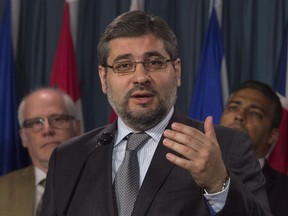 The federal government will give apologies and compensation to three Canadians, Abdullah Almalki, Ahmad El Maati and Muayyed Nureddin, who were tortured in Syria. Abdullah Almalki speaks during a press conference, in Ottawa in a May 3, 2016, file photo.