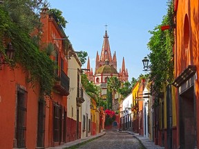 The spires of La Parroquia de San Miguel Arcangel tower over the old streets of San Miguel de Allende. It's easy to explore the city's historic centre on foot but wear sturdy walking shoes to navigate on cobblestones.