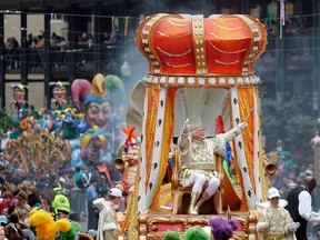 In this March 8, 2011, file photo, Rex, the King of Carnival rides in the Krewe of Rex as he arrives at Canal St. on Mardi Gras day in New Orleans.
