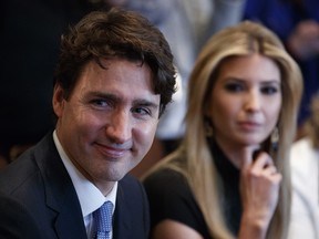 Canadian Prime Minister Justin Trudeau and Ivanka Trump, daughter of President Donald Trump, listen during a meeting with women business leaders in the Cabinet Room of the White House in Washington on Feb. 13, 2017.