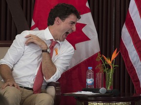 Canadian Prime Minister Justin Trudeau shares a laugh with Liberian President Ellen Johnson Sirleaf during a roundtable discussion on women's leadership, Thursday, November 24, 2016 in Monrovia, Liberia.