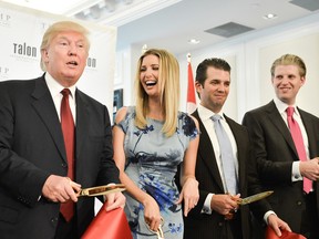 Donald Trump, Ivanka Trump, Donald Trump Jr. and Eric Trump attend the Grand Opening Ribbon Cutting Ceremony at the Trump International Hotel and Tower Toronto on April 16, 2012.