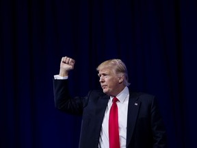 U.S. President Donald Trump gestures on stage during the Conservative Political Action Conference (CPAC) in National Harbor, Maryland, U.S., on Friday, Feb. 24, 2017