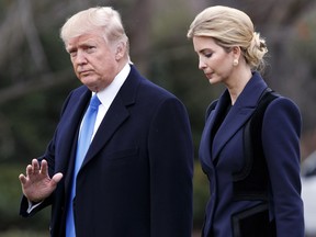 President Donald Trump, accompanied by his daughter Ivanka, waves as they walk to board Marine One on the South Lawn of the White House in Washington on Feb. 1, 2017.