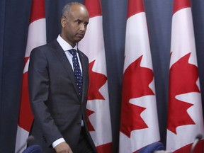 Ahmed Hussen, Minister of Immigration, Refugees and Citizenship gets ready to hold a news conference to update Canadians on the possible impacts of recent immigration-related decisions made by President Donald Trump, in Ottawa on Sunday, January 29, 2017.