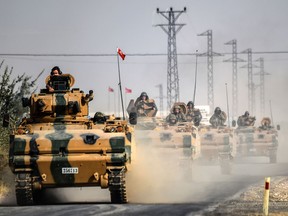 Turkish Army tanks driving to the Syrian Turkish border town of Jarabulus in a 2016 file photo.