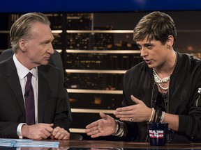 In this photo provided by HBO, host Bill Maher, left, listens to Milo Yiannopoulos