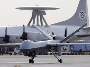 In this Nov. 8, 2011 file photo, a Predator B unmanned aircraft taxis at the Naval Air Station in Corpus Christi, Texas.