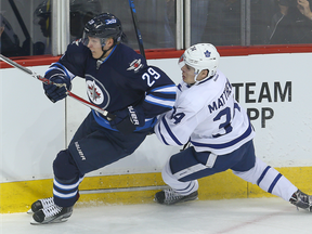 Winnipeg Jets forward Patrik Laine (left) battles Toronto Maple Leafs forward Auston Matthews on Oct. 19.