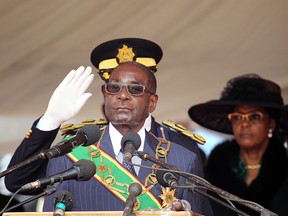 Zimbabwean President Robert Mugabe prepares to deliver his speech during Defence Forces Day celebrations in Harare, Tuesday, Aug. 9, 2016.