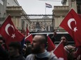 A group of Turks protest outside the Dutch consulate in Istanbul, Sunday, March 12, 2017