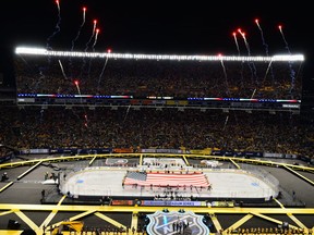 Fireworks go off as the National Anthem is sung before a game between the Pittsburgh Penguins and the Philadelphia Flyers at Heinz Field on February 25, 2017 in Pittsburgh, Pennsylvania.