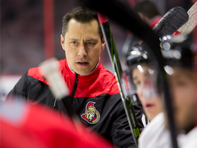 Ottawa Senators head coach Guy Boucher looks on during a practice on Feb. 13.