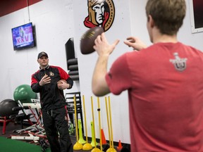 Conditioning coach Chris Schwarz works with Ottawa Senator forward Kyle Turris (R) at the CTC on March 14,2017.