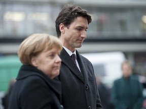 German Chancellor Angela Merkel and Canadian Prime Minister Justin Trudeau react after laying flowers at a memorial to the victims of the December Berlin terror attack at Breitscheidplattz on February 17, 2017 in Berlin, Germany. Canada's Prime Minister Justin Trudeau is visiting Germany for his first official visit after delivering a speech during a plenary session at the European Parliament in Strasbourg, France consisting of a pro-trade pitch to a conflicted Europe.
