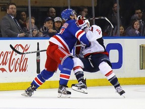 New York Rangers defenceman Ryan McDonagh takes a holding penalty on Tom Wilson of the Washington Capitals on Feb. 28.