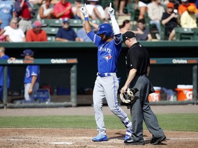 Lourdes Gurriel #13 of the Toronto Blue Jays celebrates after hitting a three-run home run in the seventh inning against the Baltimore Orioles in a spring training game on March 8, 2017 at Ed Smith Stadium in Sarasota, Florida.