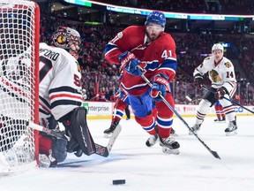 Chicago Blackhawks goaltender Corey Crawford  moves into position as Paul Byron of the Canadiens skates for the puck during their game at the Bell Centre in Montreal on Tuesday night. The Blackhawks won 4-2.