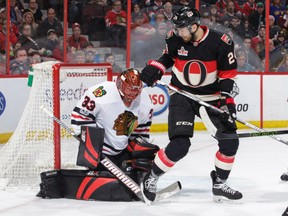 Viktor Stalberg of the Senators watches the loose puck as Chicago Blackhawks goaltender Scott Darling makes a save in the second period of their game at Canadian Tire Centre in Ottawa on Thursday night.