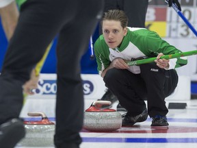 Skip Adam Casey of Saskatchewan follows the path of the rock during action at the Tim Hortons Brier Sunday in St. John's, N.L. The Casey rink won a pair of games Sunday to sit at 2-1. Team Canada and Manitoba lead the way with 3-0 records after two days of action.
