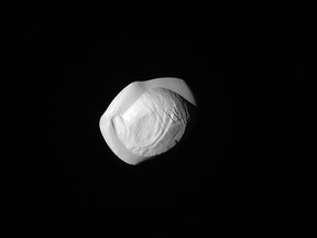 This raw, unprocessed image released by NASA shows Saturn's tiny moon, Pan, on March 7, 2017, and was taken by NASA's Cassini spacecraft.