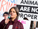 Anita Krajnc, who was charged with mischief after giving water to pigs on their way to slaughter, demonstrates outside of a courthouse ahead of closing arguments in her case, Thursday, March 9, 2017 in Burlington, Ont.