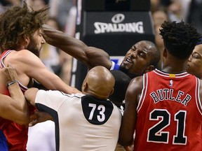 Toronto Raptors forward Serge Ibaka punches Chicago Bulls centre Robin Lopez during a scuffle on March 21.