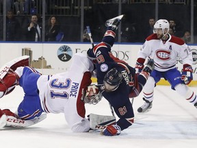Rick Nash of the Rangers collides with Montreal Canadiens goalie Carey Price  during the second period of their game, Saturday night in New York.