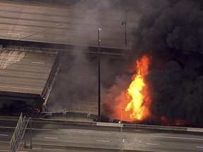 In this aerial image made from a video provided by WSB-TV, a large fire that caused an overpass on Interstate 85 to collapse burns in Atlanta, Thursday, March 30, 2017