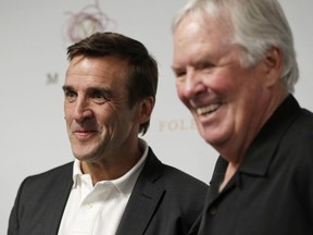 In this July 13, 2016 file photo, Vegas Golden Knights GM George McPhee, left, and franchise owner Bill Foley attend a news conference in Las Vegas.