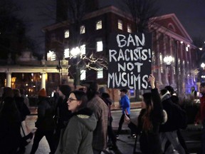 Several hundred people march past Harvard University while protesting Trump's travel ban in Cambridge, Mass., Tuesday, March 7.
