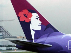 The tail of a Hawaiian Airlines aircraft parked at Manila international airport on June 16, 2008.