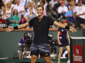 Vasek Pospisil celebrates his victory over world No. 1 Andy Murray in their second-round match at the BNP Paribas Open at Indian Wells, Calif., on March 11, 2017.