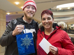 Calgary Stampeders quarterback Bo Levi Mitchell, seen here collecting donations from fans for Mitchell's Miracle Day in December in Calgary, loves the casual atmosphere and interacting with fans at CFL Week in Regina.