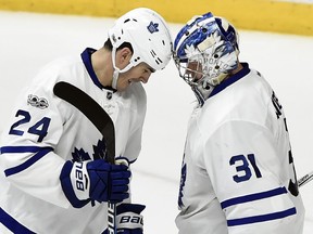 Toronto Maple Leafs centre Brian Boyle bumps helmets with goalie Frederik Andersen after the Leafs beat the Nashville Predators on Thursday, March 30, 2017 at Bridgestone Arena.