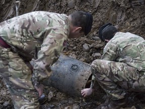 In this image taken Thursday March 2, 2017  released  by the Ministry of Defence shows  a Second World War bomb which was discovered on a building site in Brent, north-west London