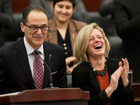 Alberta Finance Minister Joe Ceci, with Premier Rachel Notley beside him, tables Budget 2017 in the Alberta Legislature in Edmonton on Thursday, March 16, 2017.