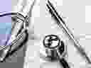 Health care billing statement with stethoscope, pen. 