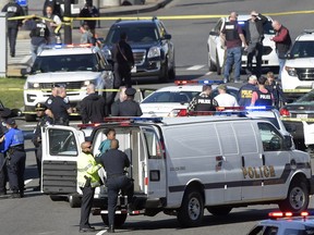 A suspect, center, is taken into custody on Capitol Hill in Washington, Wednesday, March 29, 2017