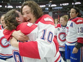 Noemie Marin, right, hugs teammate Katie Clement-Heydra of the Montreal Canadiennes following their 3-1 win over the Calgary Inferno in the Clarkson Cup final at the Canadian Tire Centre in Ottawa on Sunday.
