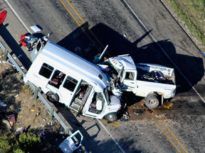 Authorities investigate after a deadly crash involving a minibus carrying church members and a pickup truck on U.S. 83 outside Garner State Park, Texas, March 29, 2017.