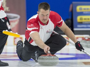 Team Canada lead Ben Hebert delivers a rock as they play Alberta in draw 10 action at the Tim Hortons Brier at Mile One Centre, in St. John's on Tuesday. Hebert is nursing a knee injury and is playing on a game-to-game basis.