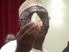 Sierra Leone's Minister of Mines and Mineral Resources Alhaji Minkailu Mansaray holds the jumbo 706-carat diamond discovered by a pastor in the country.