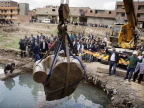 A massive statue, that may be of pharaoh Ramses II, one of the country's most famous ancient rulers, is pulled out of grondwater in a Cairo slum, Egypt, Monday, March 13, 2017.