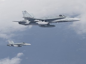 Two CF-18s from 4 WING COLD LAKE are getting ready to be refuelled by the CC-150 Polaris, part of Maple Flag XLII (MF42).