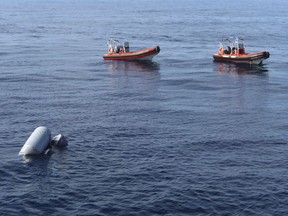 In this photo released by Proactiva Open Arms NGO on Friday, March 24, 2017 a sunken rubber boat in the Mediterranean Sea off the Libyan coast, during a search and rescue operation by Spanish NGO Proactiva Open Arms. A Spanish aid organization says it fears hundreds of migrants may have died off the coast of Libya after five bodies were found near two capsized boats and the search for a third vessel reported missing had so far proved futile. (Proactiva Open Arms via AP)